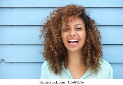 Portrait of a cheerful young african woman smiling