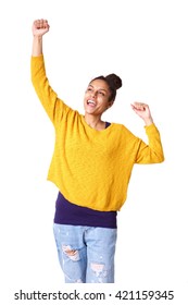 Portrait of cheerful young african woman with arms raised
