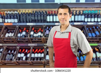 Portrait of cheerful young employee at a winery looking at camera smiling - Powered by Shutterstock