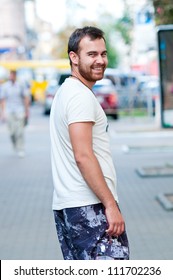 Portrait Of Cheerful Young Man. Smiling And Looking At The Camera.