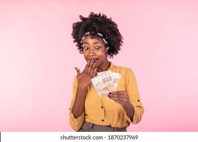 Portrait Of A Cheerful Young Woman Holding Money. African American Woman Holding Euro Bank Notes, Feeling Happy And Satisfied