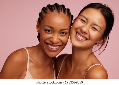 Portrait of a cheerful young women looking at camera and smiling.  Natural Beauties with fresh and clean skin