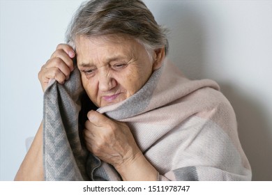 Portrait Of A Cheerless Aged Woman While Feeling Cold. Older  Woman Is Having Flu And Sneezing From Sickness Seasonal Virus Problem. Fever And Cold In Senior People With Influenza Illness