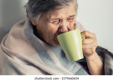  Portrait Of A Cheerless Aged Woman While Feeling Cold. Older  Woman Is Having Flu And Sneezing From Sickness Seasonal Virus Problem. Fever And Cold In Senior People With Influenza Illness