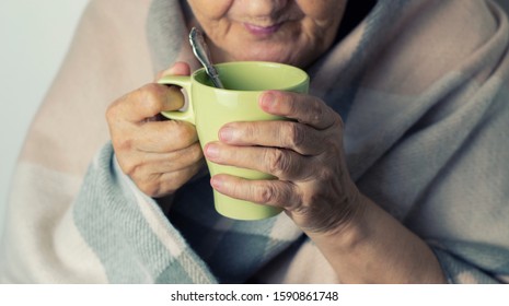 Portrait Of A Cheerless Aged Woman While Feeling Cold. Older  Woman Is Having Flu And Sneezing From Sickness Seasonal Virus Problem. Fever And Cold In Senior People With Influenza Illness