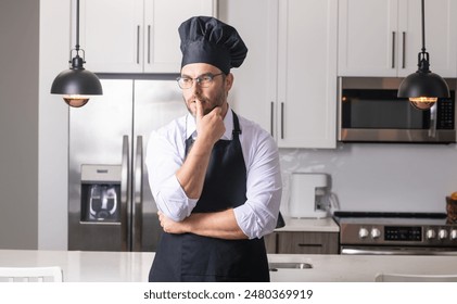 Portrait of chef, cooks or baker. Man in cook hat and chef uniform cooking on kitchen. - Powered by Shutterstock