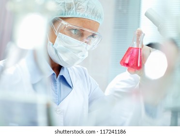 Portrait Of A Chemist Holding A Tube With Liquid