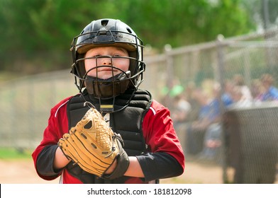 Portrait Of Child Baseball Player Wearing Catcher Gear