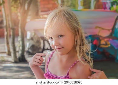 portrait of a child beautiful girl 5 years old in a bikini smiling cheerfully