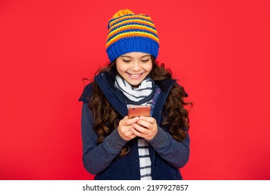 Portrait Of Child Blogging With Phone. Express Positive Emotion. Greeting With Winter Holidays.