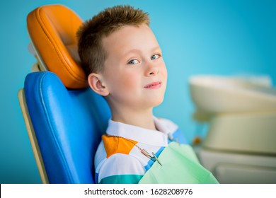 A Portrait Of A Child Boy In The Cabinet Of A Dentist. Treatment, Medicine, Hospital.