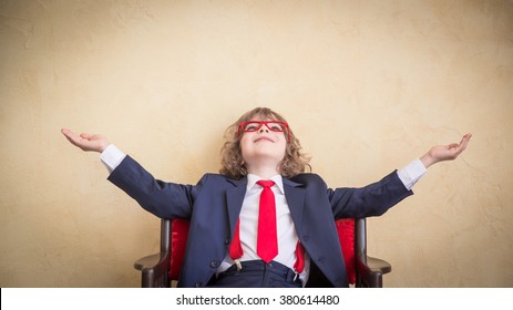 Portrait of child businessman in office. Successful confident business kid