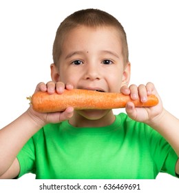 Portrait of a child with a carrot in hands