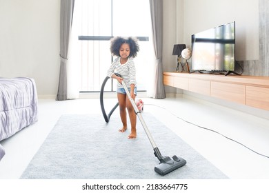 Portrait Of Child Cute Mixed Race Girls Cleaning The Floor In The Bedroom At Home By Using A Vacuum Cleaner Fun Talks Expressing Love For Each Other, Concept Growth, Development, Family Relationships.