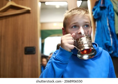 Portrait Of Child Drinking Tea In Train Compartment