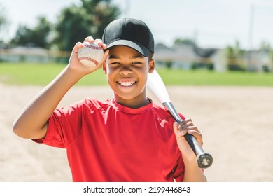 A portrait of child with glove and looking at camera playing baseball - Powered by Shutterstock