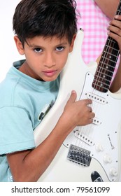 Portrait Of A Child With Guitar