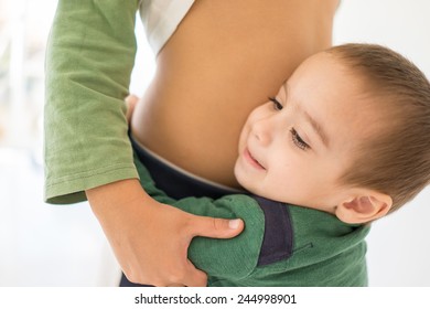 Portrait Of Child Hugging His Bigger Brother