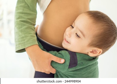 Portrait Of Child Hugging His Bigger Brother