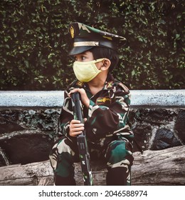 Portrait Of A Child In Indonesian Army Uniform