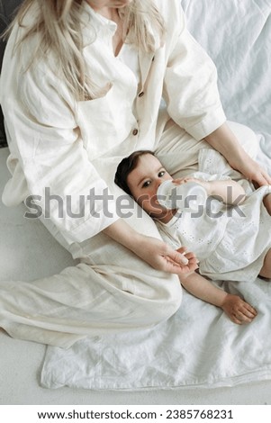 Similar – Image, Stock Photo Man reading with wife and son sleeping