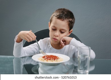 Portrait Of Child With No Appetite In Front Of The Meal. Concept Of Loss Of Appetite