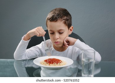 Portrait Of Child With No Appetite In Front Of The Meal. Concept Of Loss Of Appetite