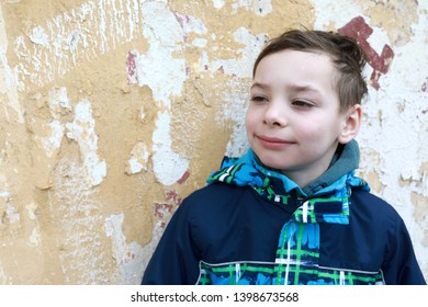 Portrait of child on old wall background