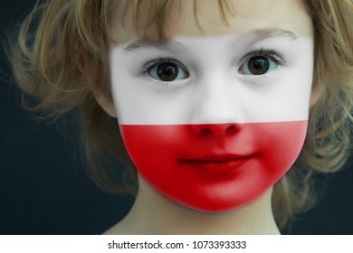 Portrait Of A Child With A Painted Polish Flag On Her Face, Closeup.