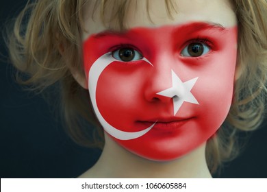 Portrait Of A Child With A Painted Turkish Flag On Her Face, Closeup.