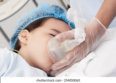 Portrait of child patient receiving artificial ventilation in hospital