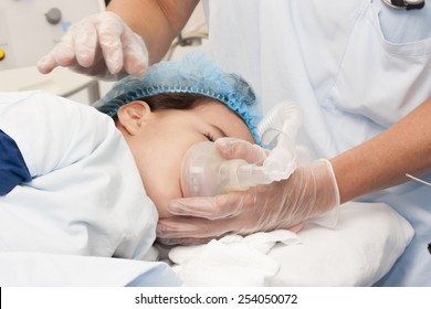 Portrait Of Child Patient Receiving Artificial Ventilation In Hospital