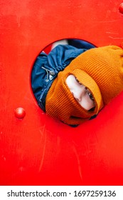 Portrait Of Child At Playground - Child Wearing Balaclava - Portrait Of Child In Red Background