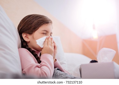 Portrait Of A Child With A Running Nose