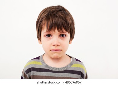 Portrait Of A Child With Sad Face Crying 