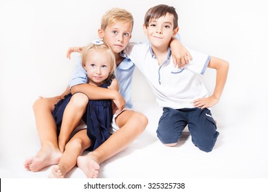 Portrait Of Children: Two Boys With One Girl