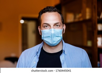 Portrait Of Clear Boy With Surgical Mask Dressed Casual Standing In The Living Room At Home