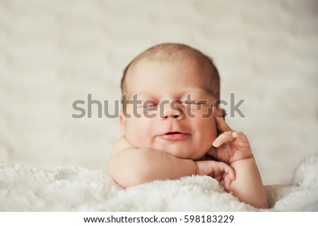 Similar – Newborn baby awake on a blanket