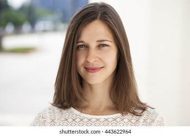 Portrait close up of young beautiful brunette woman, summer outdoors