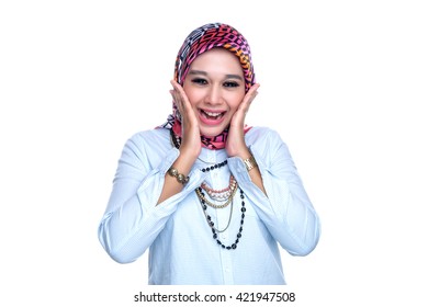 Portrait or close up of a young female Muslim lady with facial and hand expression on a white background