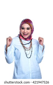Portrait or close up of a young female Muslim lady with facial and hand expression on a white background