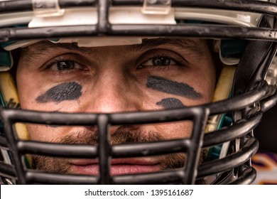 Portrait close-up, American football player, bearded in helmet. Concept American football, patriotism, close-up. - Powered by Shutterstock