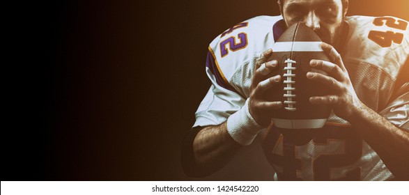 Portrait close-up, American football player, bearded without a helmet with the ball in his hands. Concept American football, patriotism, close-up. special effect illumination, film grain - Powered by Shutterstock