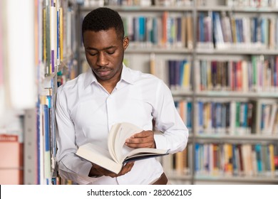 Portrait Of A College Student Man In Library - Shallow Depth Of Field