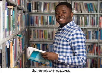 Portrait Of A College Student Man In Library - Shallow Depth Of Field