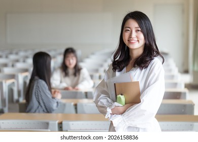 Portrait Of A College Student Standing In A Lecture Room