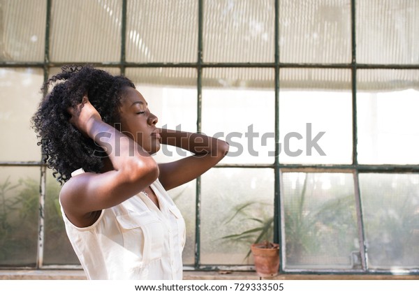 Portrait Concentrated Young Woman Tousling Hair Stock Photo Edit
