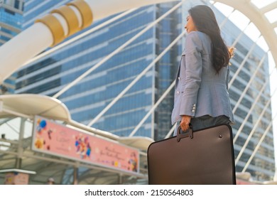 Portrait Of Confidence Asian Businesswoman Office Worker In Casual Suit Walking In Railway Station Urban City Street. Business Woman Go To Working At Office Building District In Morning Rush Hour