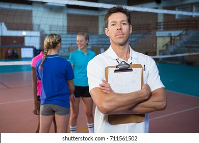 Portrait of confidence male coach standing in the court - Powered by Shutterstock