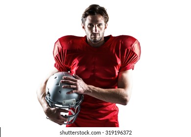 Portrait of confident American football player in red jersey holding helmet on a white background - Powered by Shutterstock